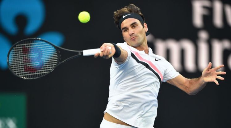 Switzerland's Roger Federer hits a return against Australia's Alex De Minaur during their men's singles first round match on day two of the Australian Open tennis tournament in Melbourne on January 16, 2018. / AFP PHOTO / PETER PARKS / -- IMAGE RESTRICTED TO EDITORIAL USE - STRICTLY NO COMMERCIAL USE --        (Photo credit should read PETER PARKS/AFP/Getty Images)